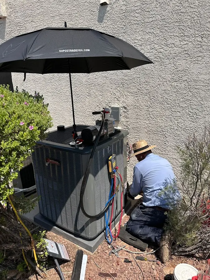 HVAC technician performing outdoor AC maintenance in Cedartown